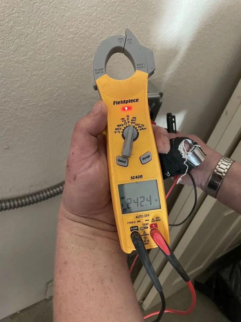 Voltage testing with clamp meter during Whole House Surge Protector in Creswell